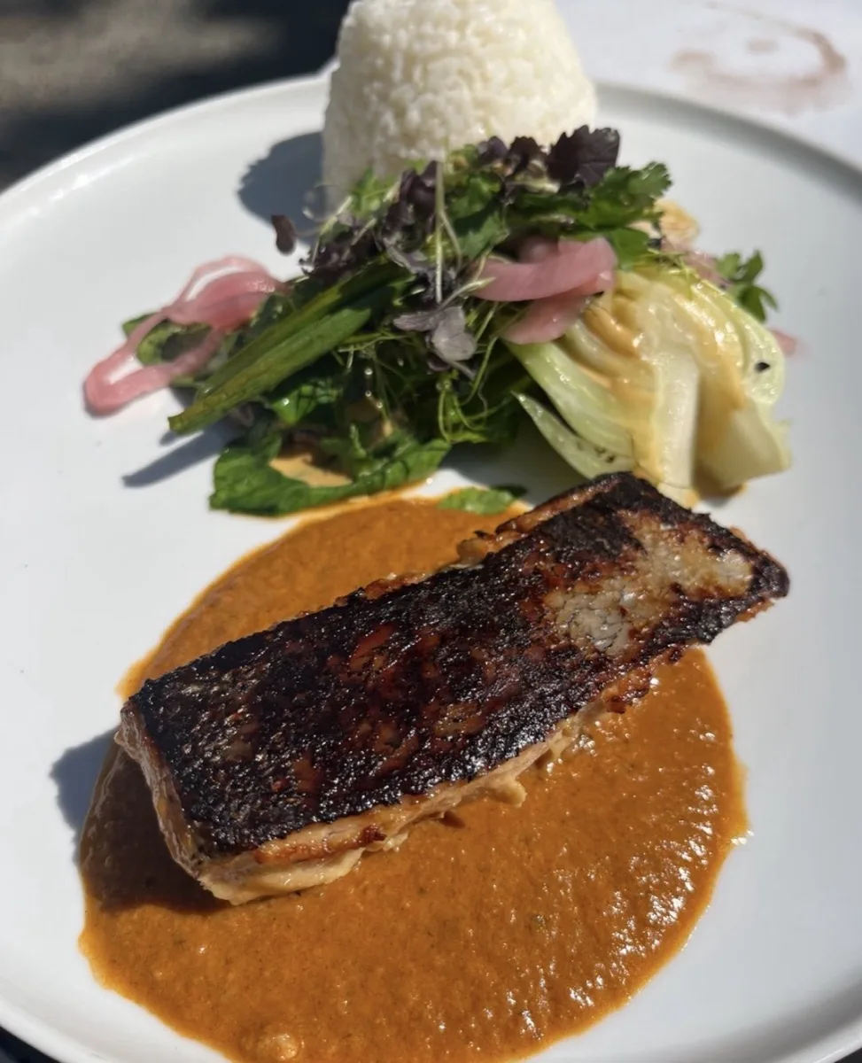 Blackened fish fillet on romesco sauce